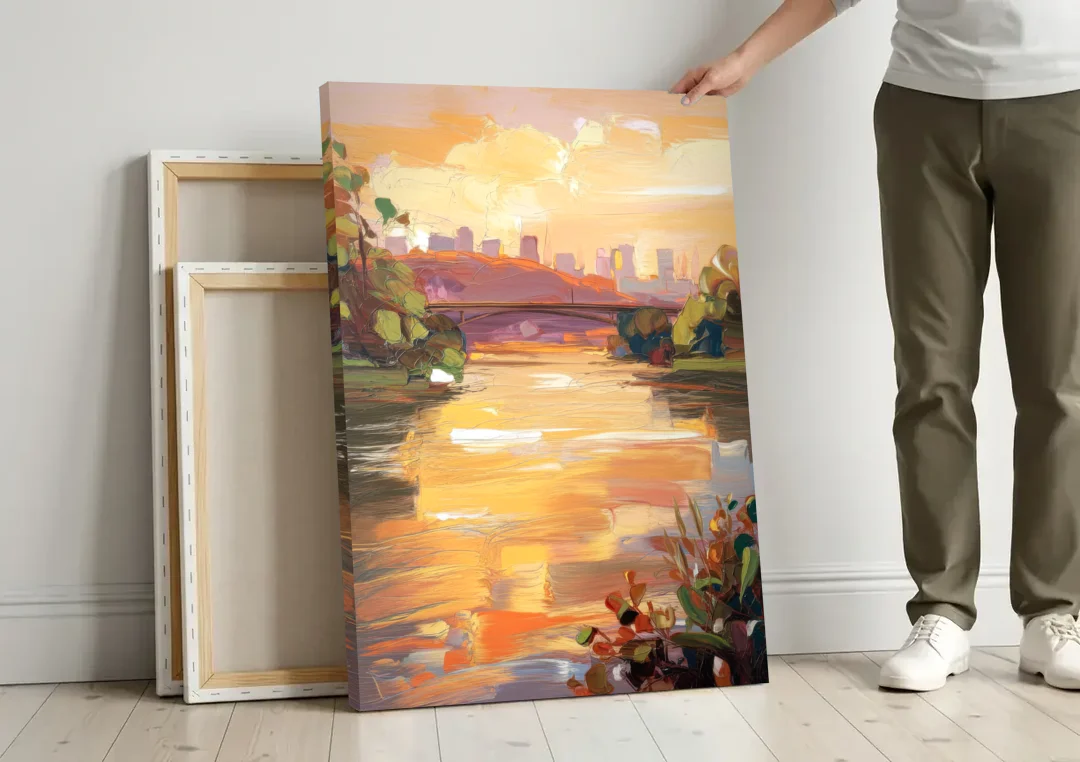 Knoxville Tennessee River View canvas wall art leaning against a wall next to blank canvases