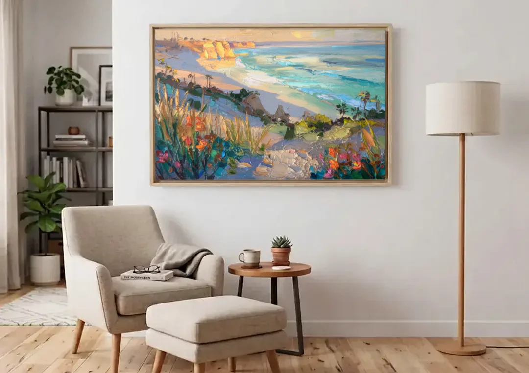 La Jolla Pacific Blues canvas wall art above an armchair in a bright living room