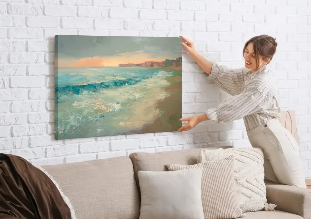 La Jolla Seaside Charm canvas wall art being hung on a white brick wall above a sofa