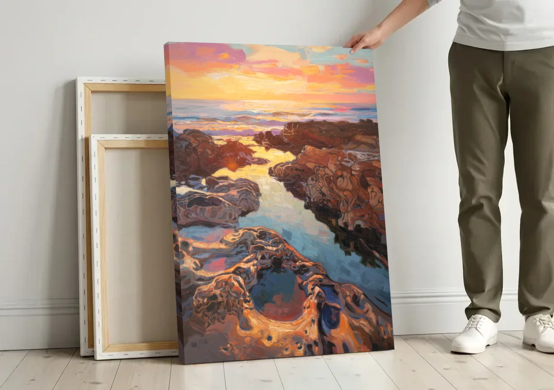 La Jolla Tidepools canvas wall art leaning against a wall next to blank canvases