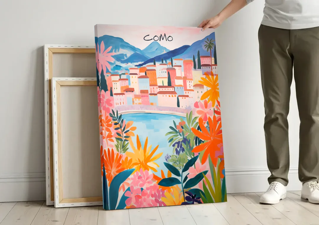 Lake Como Art in Tropical Bloom canvas wall art leaning against a wall next to blank canvases