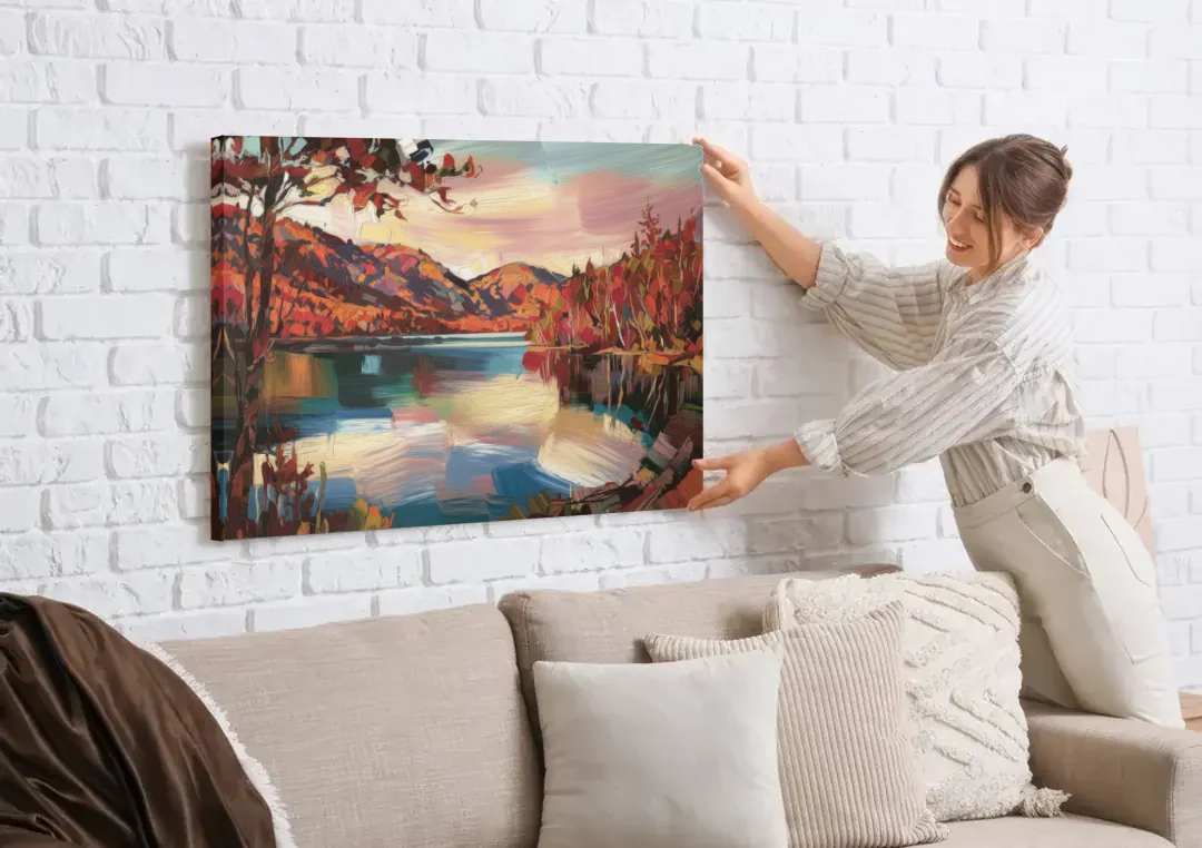 Lake Placid Adirondack Serenity canvas wall art being hung on a white brick wall above a sofa