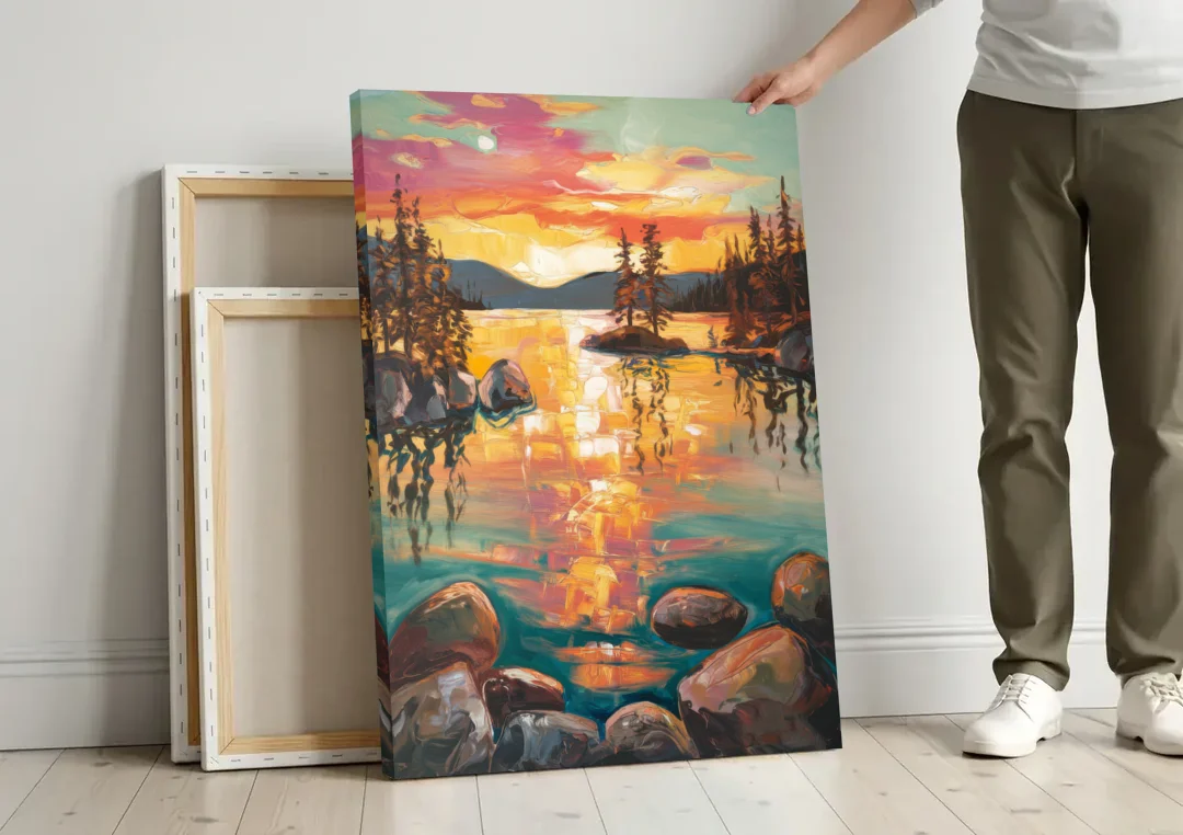 Lake Tahoe Sunset Reflections canvas wall art leaning against a wall next to blank canvases