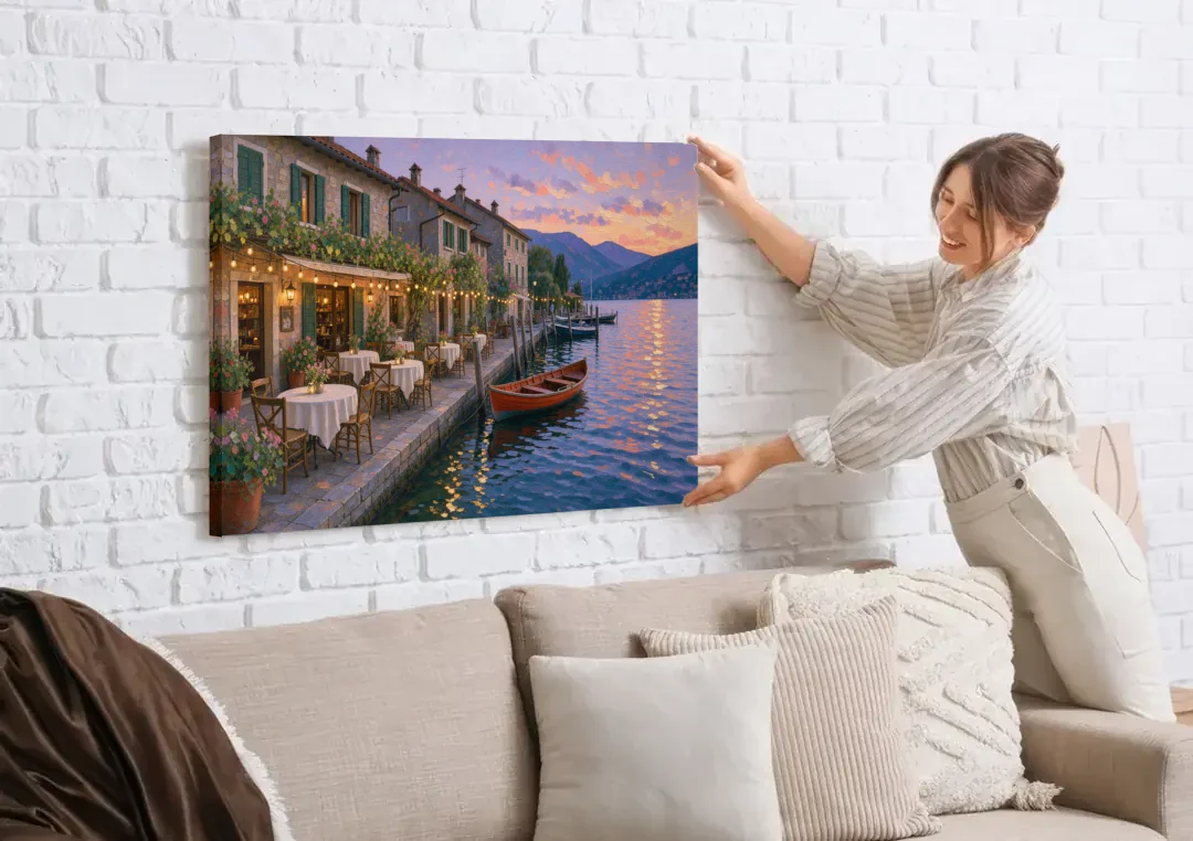 Lakeside Trattoria Under String Lights canvas wall art being hung on a white brick wall above a sofa