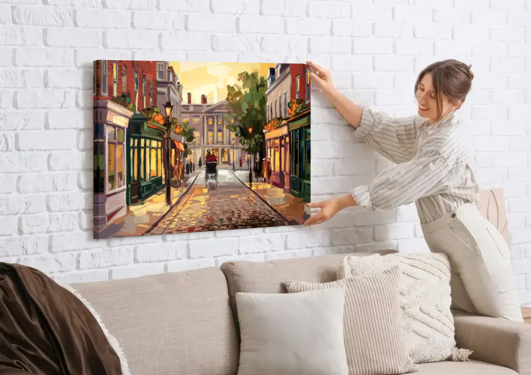 Lancaster Historic Downtown canvas wall art being hung on a white brick wall above a sofa