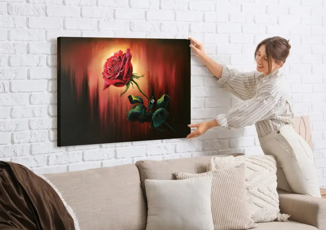 Lancaster Red Rose City Heritage canvas wall art being hung on a white brick wall above a sofa