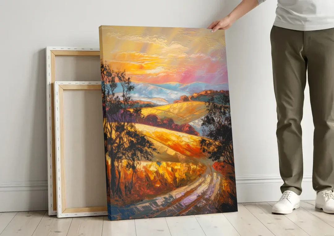 Lancaster Sunset Views canvas wall art leaning against a wall next to blank canvases