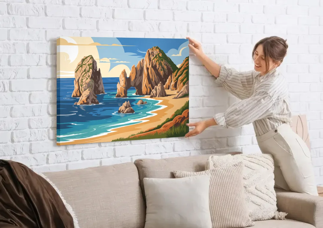 Land’s End Rock Formations canvas wall art being hung on a white brick wall above a sofa