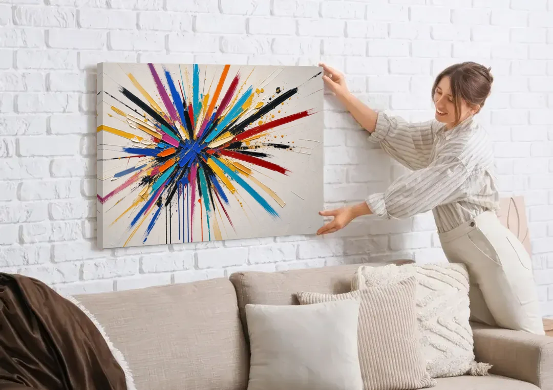 Large Abstract Canvas Art of a Cobalt Burst canvas wall art being hung on a white brick wall above a sofa
