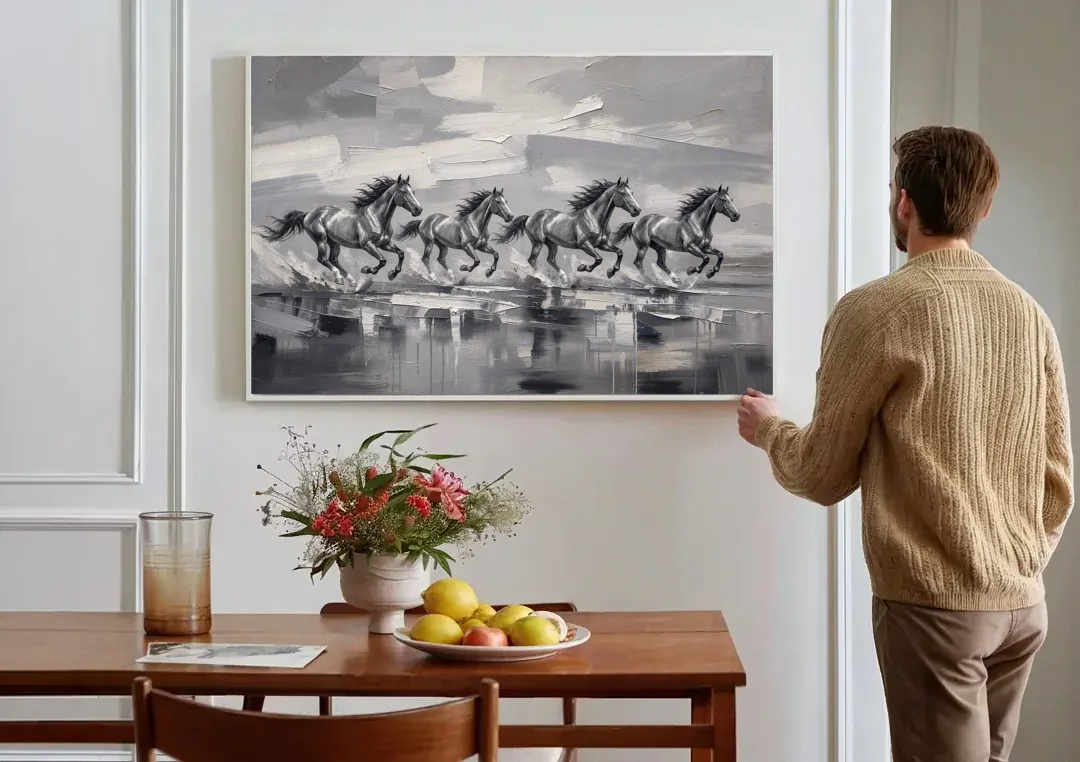 Large Black and White Scene of Four Galloping Horses canvas wall art above a dining table