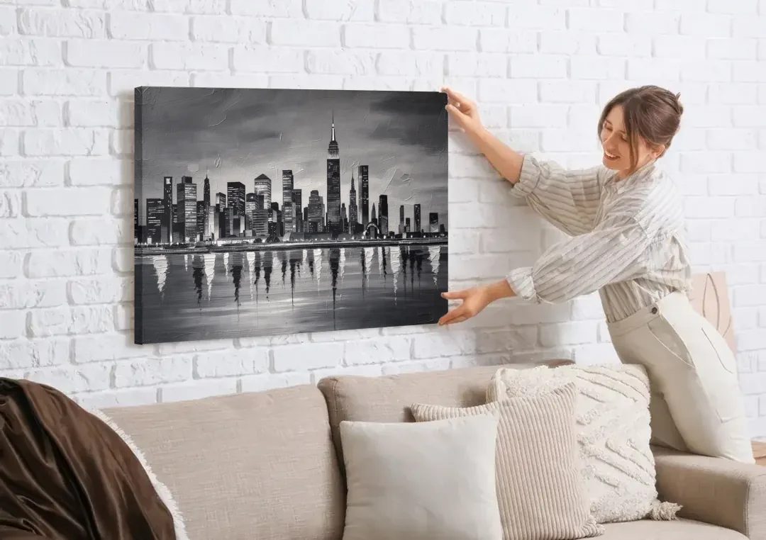 Large Black and White Wall Art for Living Room canvas wall art being hung on a white brick wall above a sofa