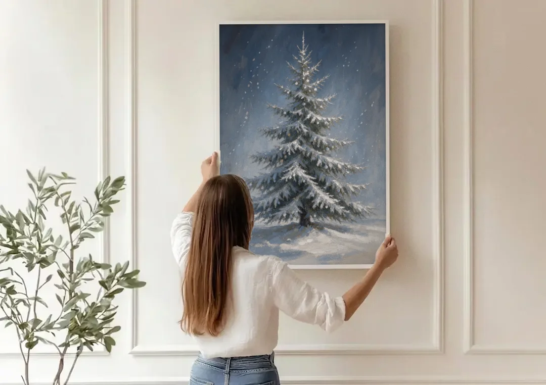 Large Christmas Canvas Art of a Snowy Silver Spruce canvas wall art being hung on a paneled wall
