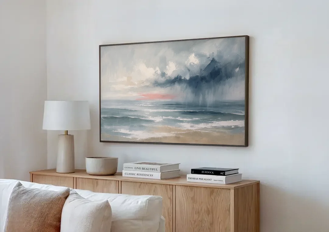 Large Coastal Wall Art of a Distant Squall canvas wall art above a wooden sideboard next to a sofa