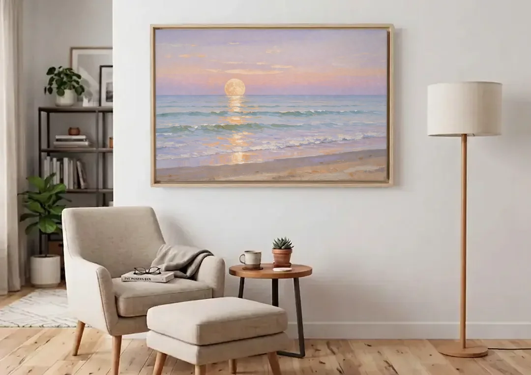 Large Golden Moonrise Over Rolling Ocean Surf canvas wall art above an armchair in a bright living room