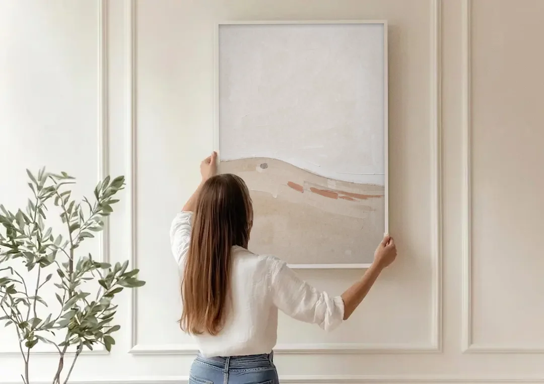 Large Minimalist Wall Art of a Clay Slope canvas wall art being hung on a paneled wall
