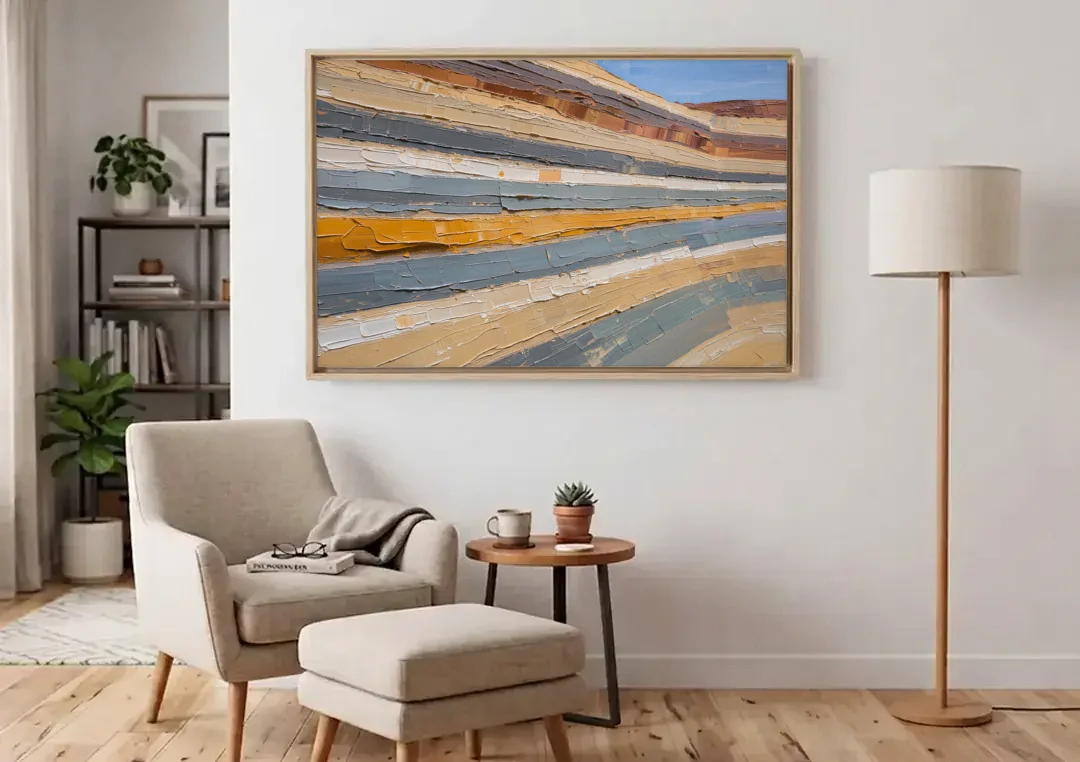 Large Office Wall Art of Layered Canyon Strata canvas wall art above an armchair in a bright living room