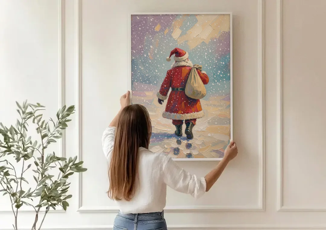 Large Santa Canvas Walking into the Snow canvas wall art being hung on a paneled wall