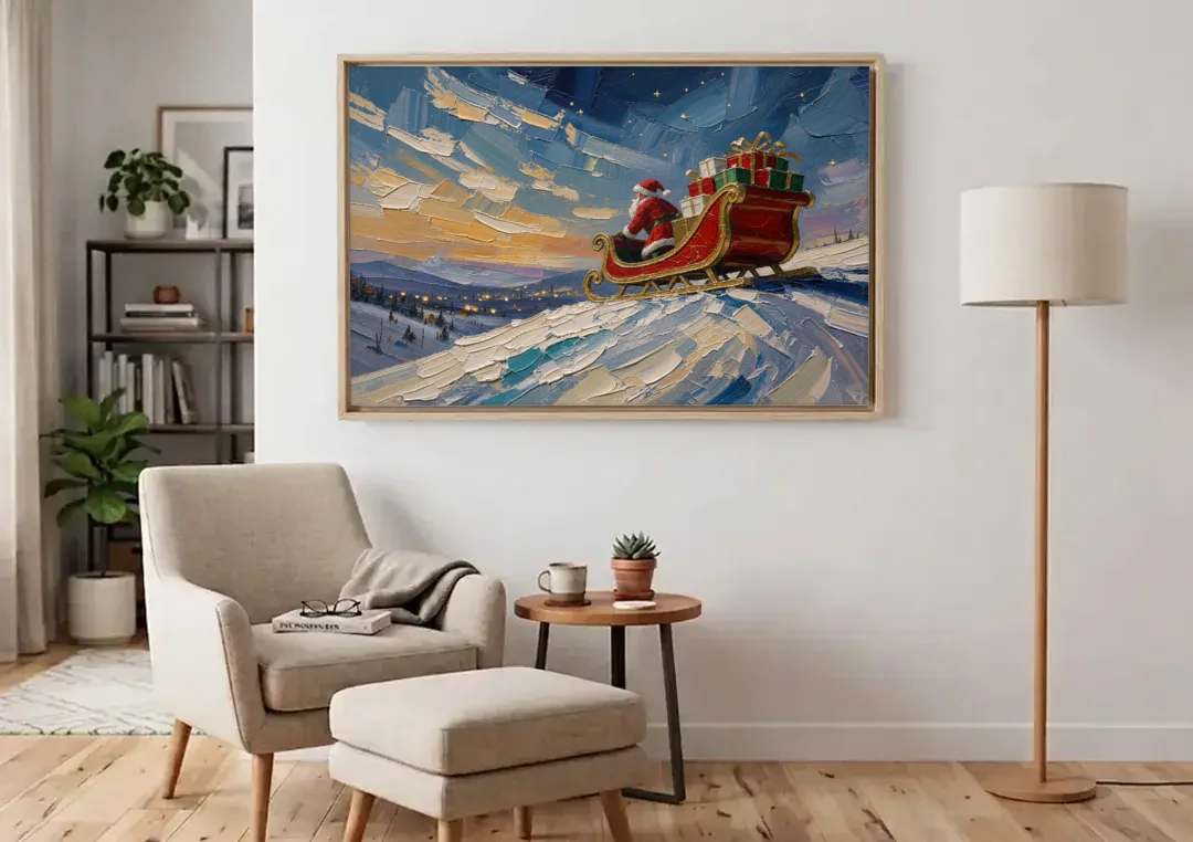Large Santa Wall Art of the Hilltop Sleigh canvas wall art above an armchair in a bright living room