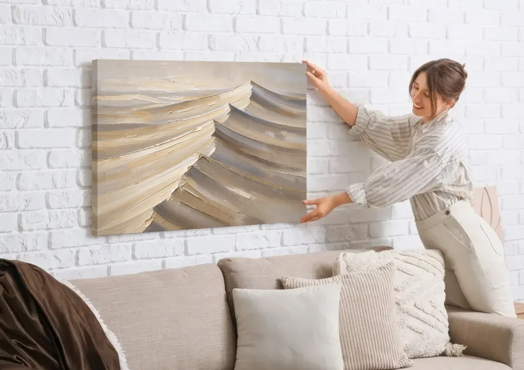 Large Wall Art for Living Room Knife-Cut Dune Crests canvas wall art being hung on a white brick wall above a sofa