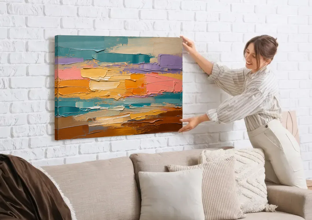 Large Wall Decor for Living Room Amber Field canvas wall art being hung on a white brick wall above a sofa