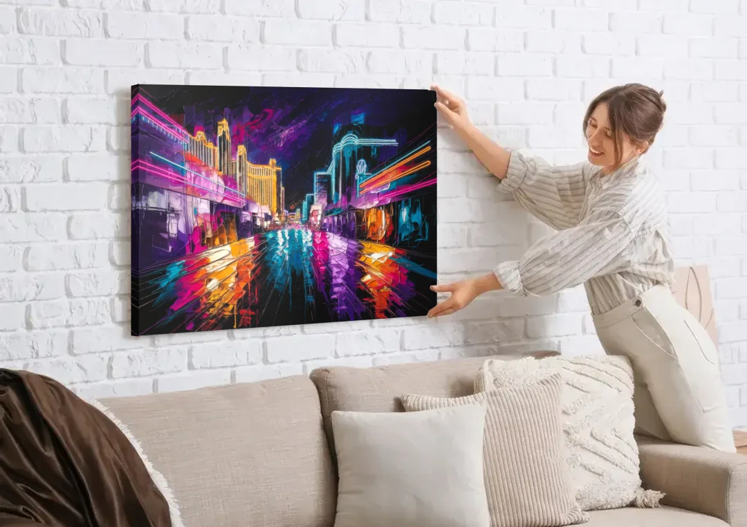 Las Vegas Neon Nights canvas wall art being hung on a white brick wall above a sofa