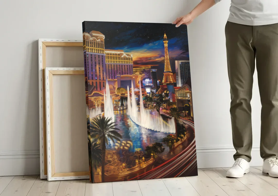 Las Vegas Nightscape canvas wall art leaning against a wall next to blank canvases