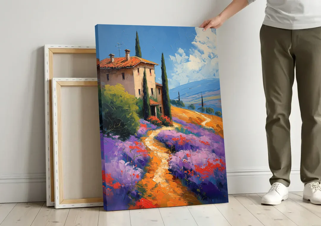 Lavender Painting of a Tuscan Farm Path canvas wall art leaning against a wall next to blank canvases