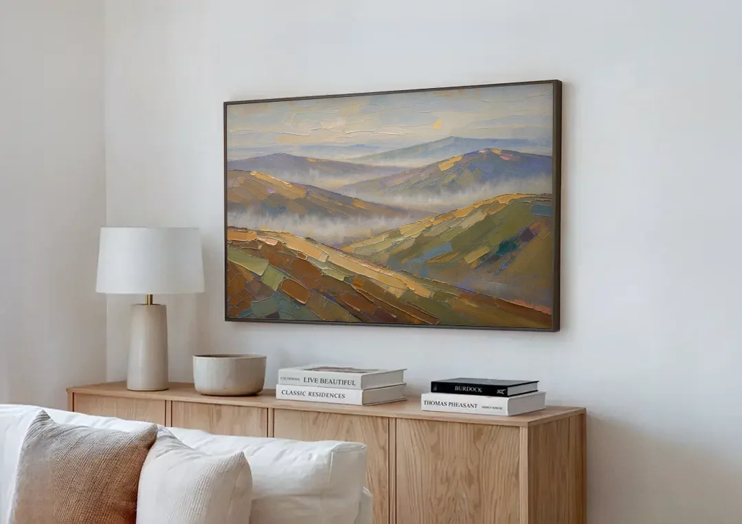 Layered Valley Ridges in Morning Haze canvas wall art above a wooden sideboard next to a sofa