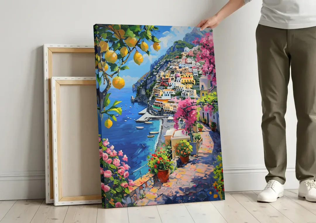 Lemon Tree Painting Above Positano canvas wall art leaning against a wall next to blank canvases