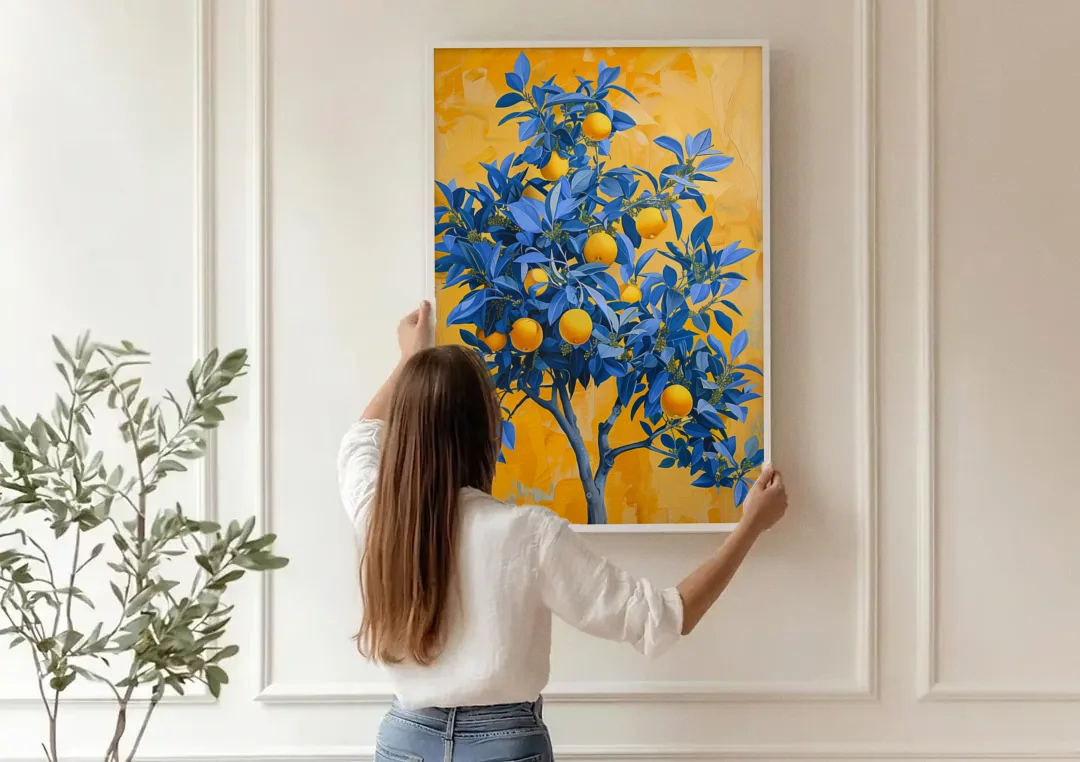 Lemon Tree Wall Art in Blue and Gold canvas wall art being hung on a paneled wall