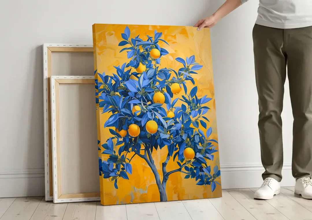 Lemon Tree Wall Art in Blue and Gold canvas wall art leaning against a wall next to blank canvases