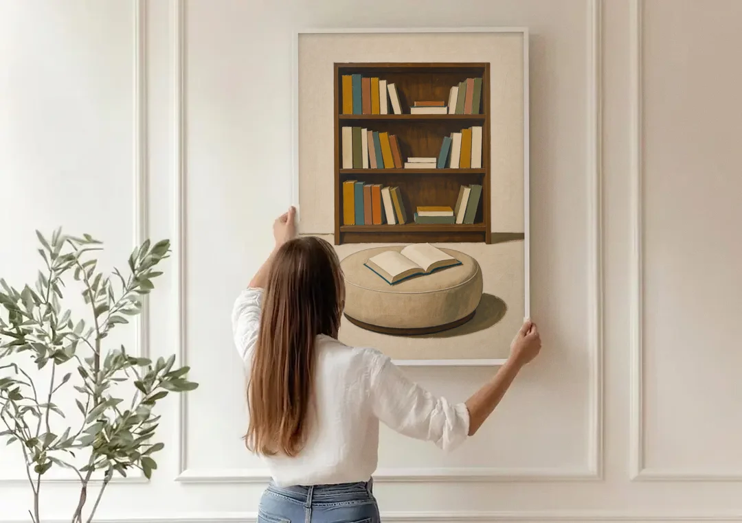 Library Wall Art with Walnut Bookcase and Pouf canvas wall art being hung on a paneled wall