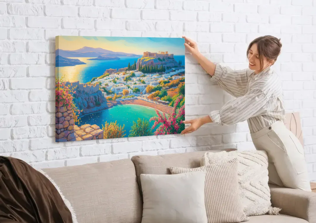 Lindos Views canvas wall art being hung on a white brick wall above a sofa