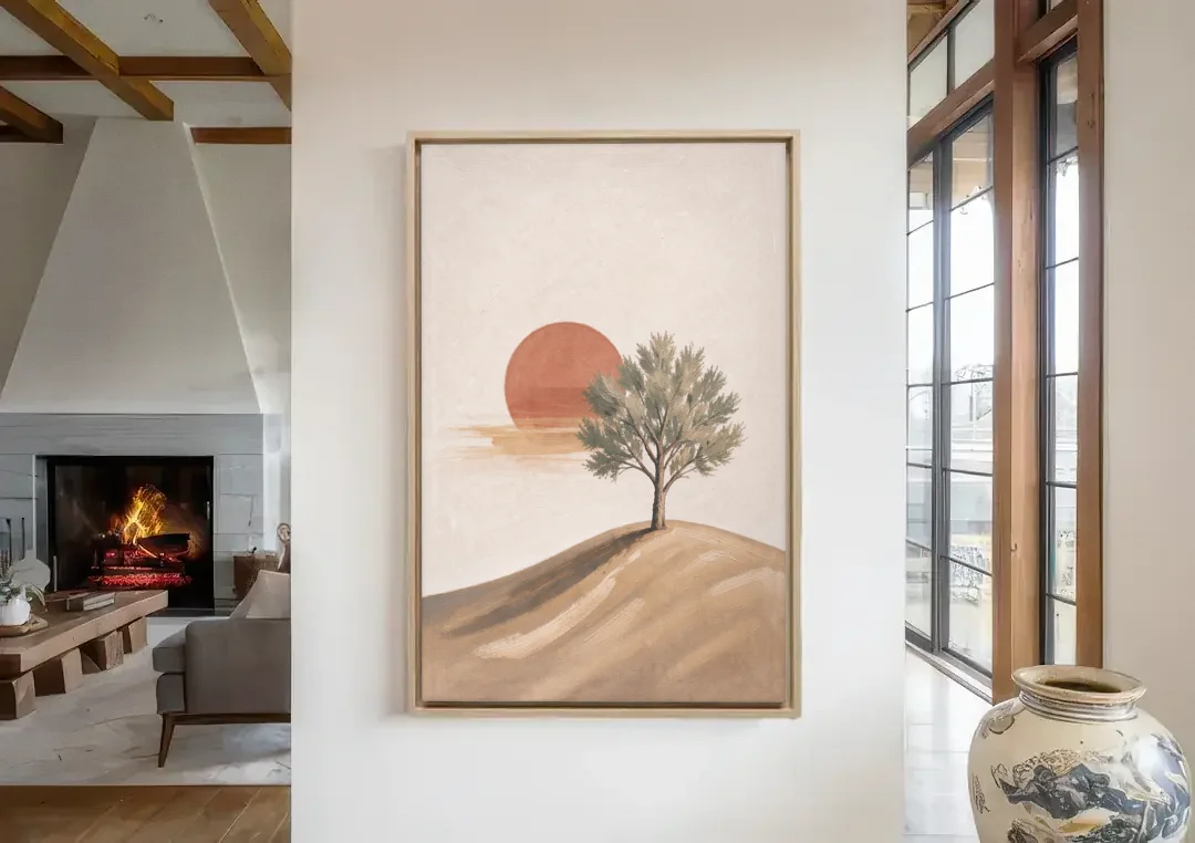 Lone Tree on a Hill Before a Rust Sun canvas wall art in a living room with a fireplace