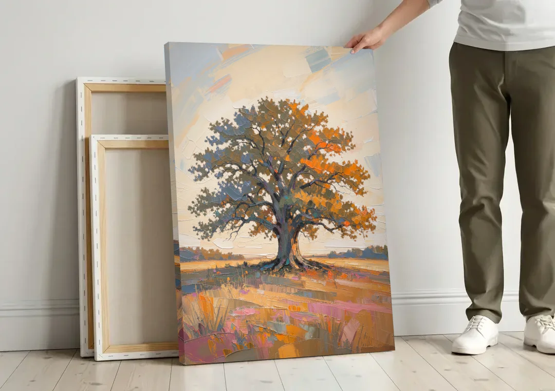 Lone Tree Painting of an Oak at Golden Hour canvas wall art leaning against a wall next to blank canvases