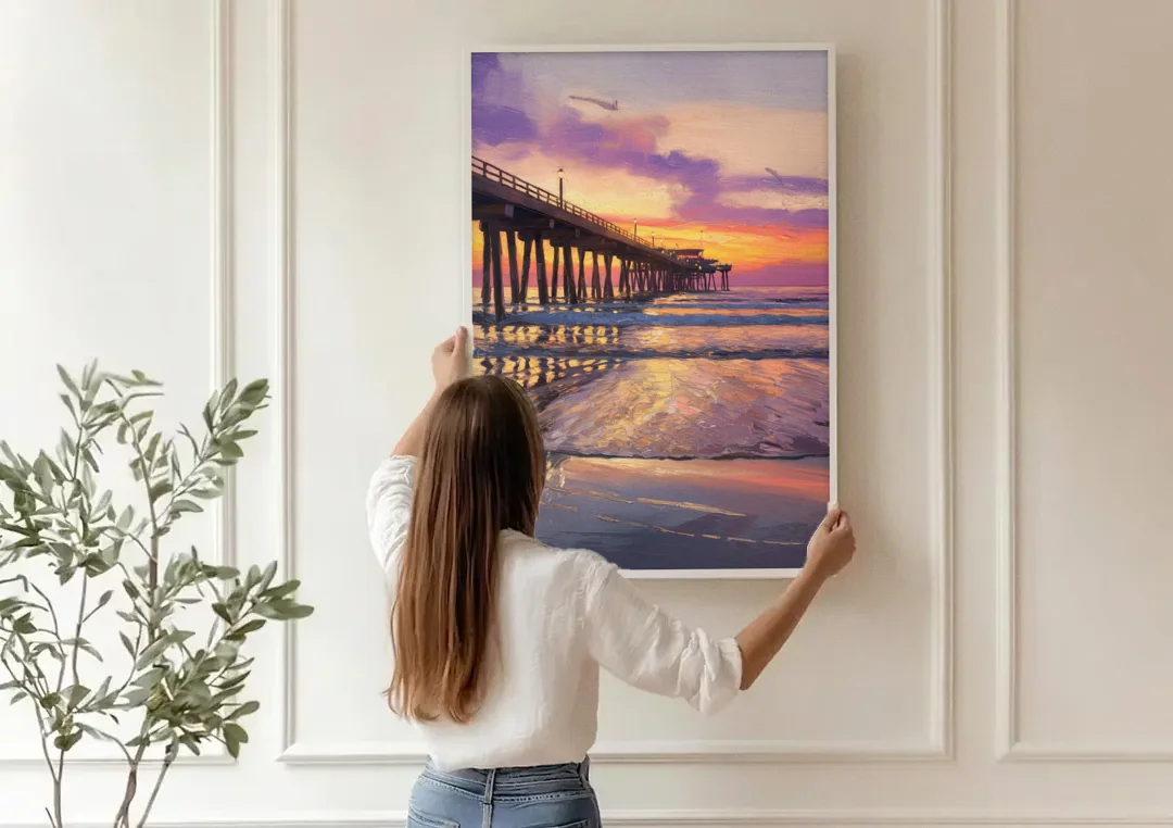 Long Beach Pier at Sunset canvas wall art being hung on a paneled wall