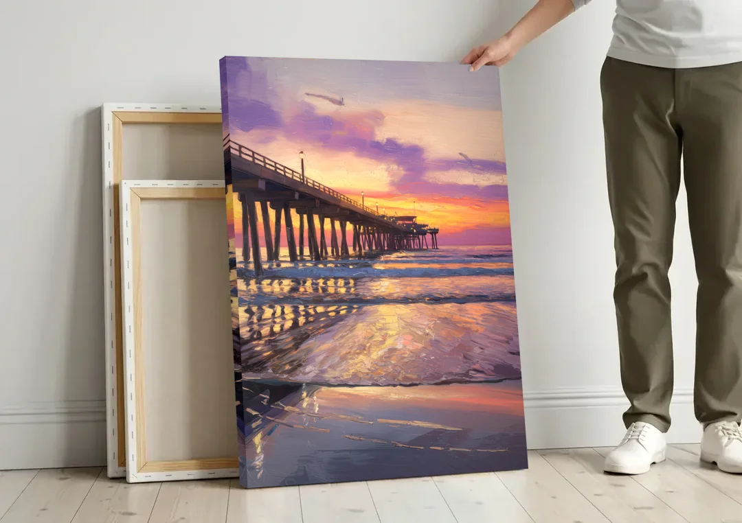 Long Beach Pier at Sunset canvas wall art leaning against a wall next to blank canvases