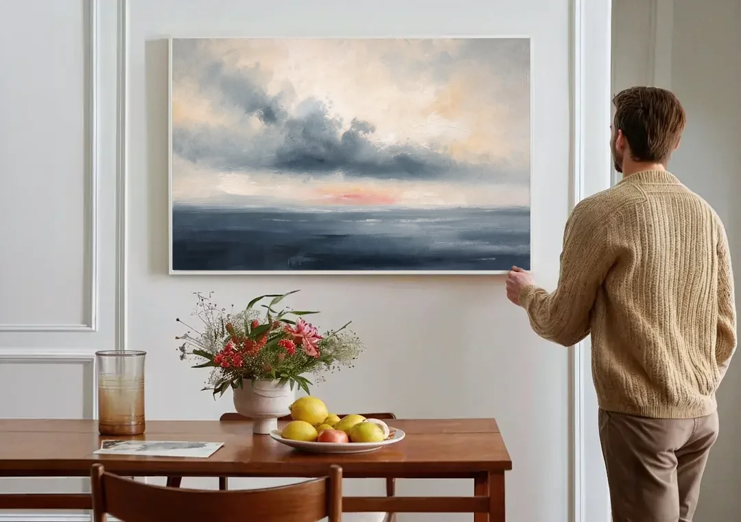 Long Horizontal Cloud Bank Over a Calm Sea canvas wall art above a dining table