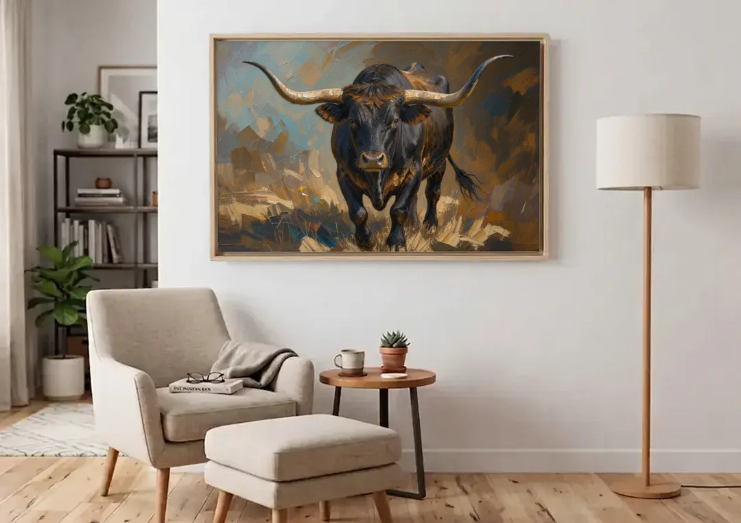 Longhorn Painting of a Black Steer Striding Forward canvas wall art above an armchair in a bright living room