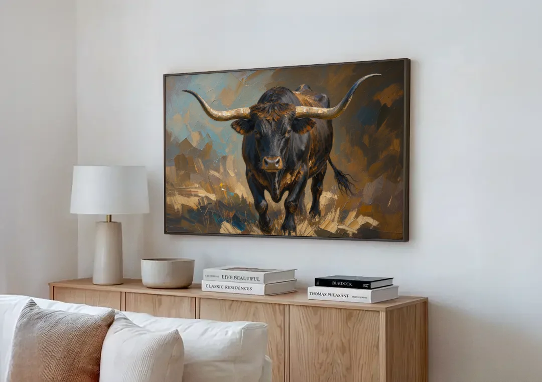 Longhorn Painting of a Black Steer Striding Forward canvas wall art above a wooden sideboard next to a sofa
