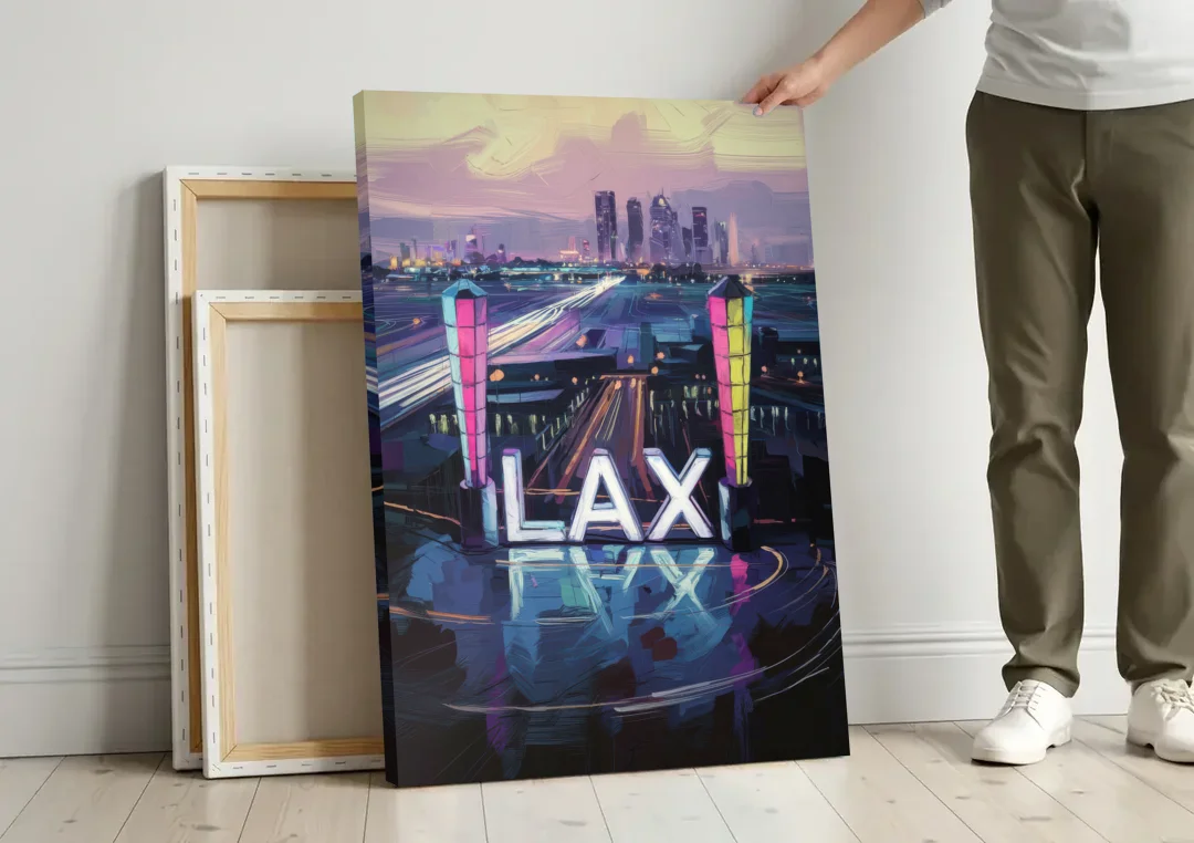 Los Angeles Airport Aerial View canvas wall art leaning against a wall next to blank canvases
