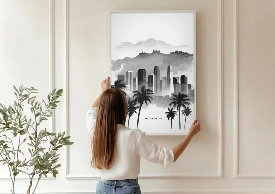 Los Angeles Black and White Cityscape canvas wall art being hung on a paneled wall