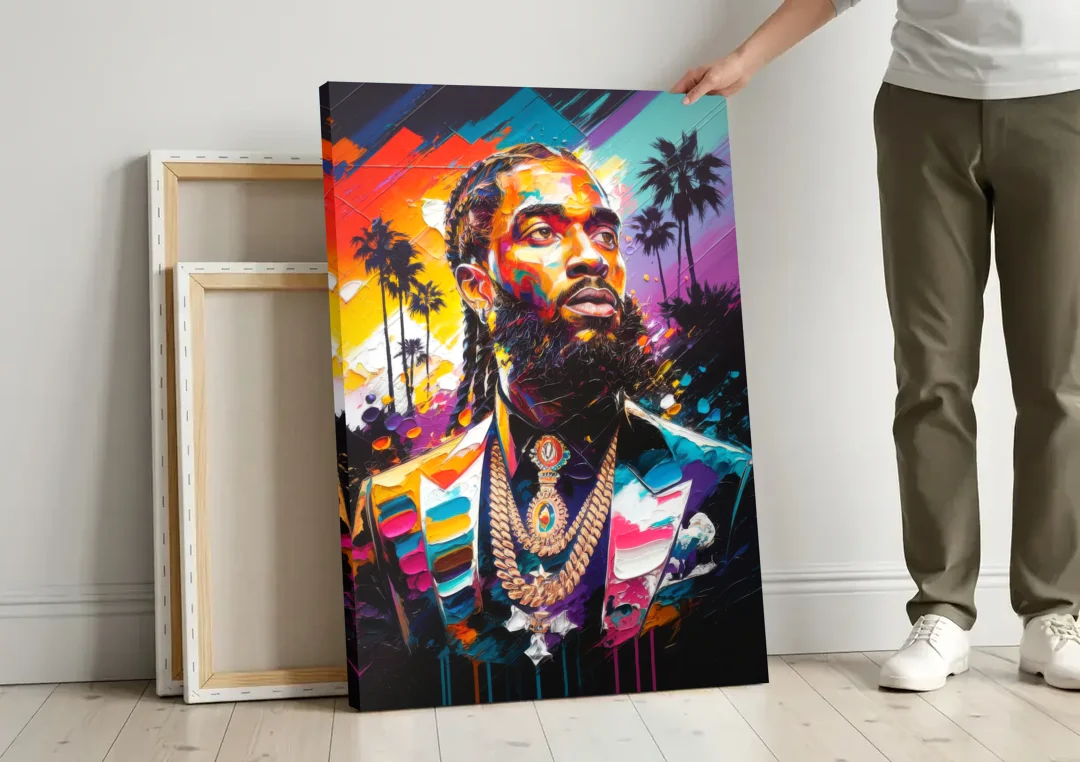 Los Angeles Nipsey Hussle Tribute canvas wall art leaning against a wall next to blank canvases