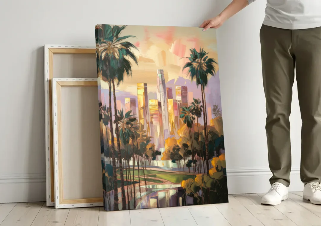 Los Angeles Palm Trees and Skyscrapers canvas wall art leaning against a wall next to blank canvases