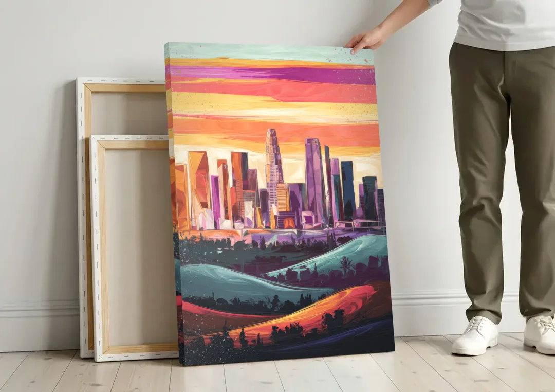 Los Angeles Skyline at Sunset canvas wall art leaning against a wall next to blank canvases