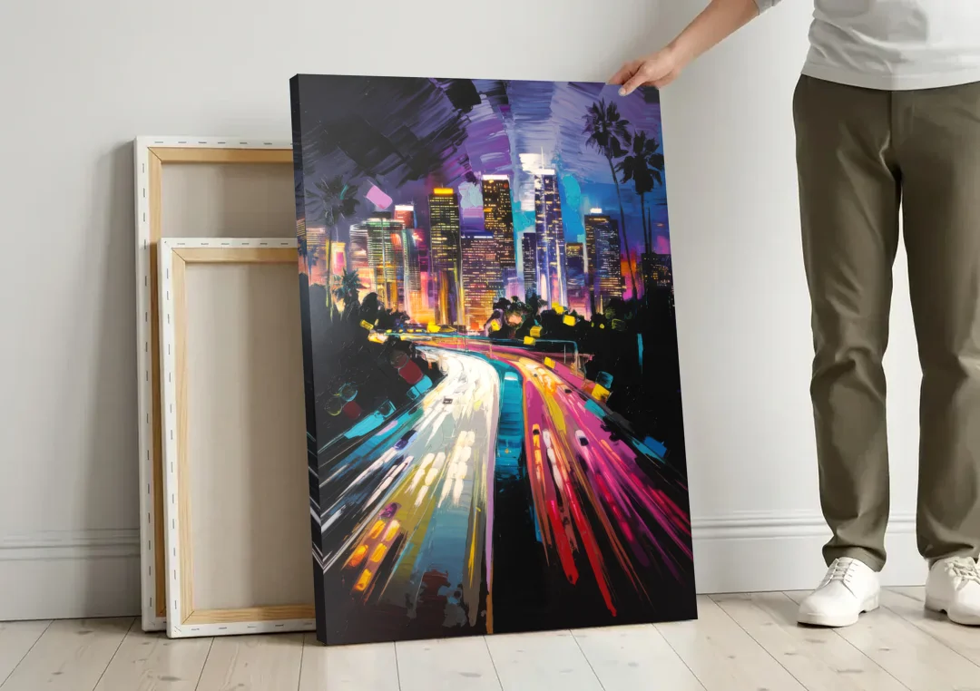 Los Angeles Urban Cityscape canvas wall art leaning against a wall next to blank canvases