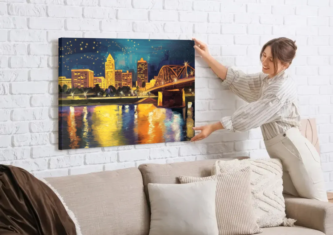 Louisville Cityscape Glow canvas wall art being hung on a white brick wall above a sofa