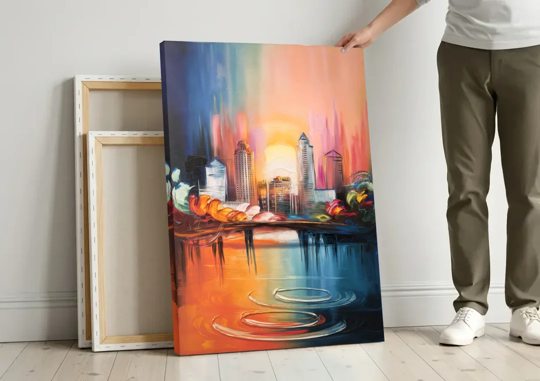 Louisville Skyline at Sunrise canvas wall art leaning against a wall next to blank canvases
