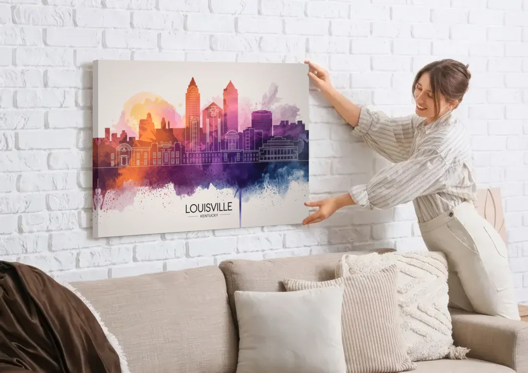 Louisville Sunset Over Skyline canvas wall art being hung on a white brick wall above a sofa
