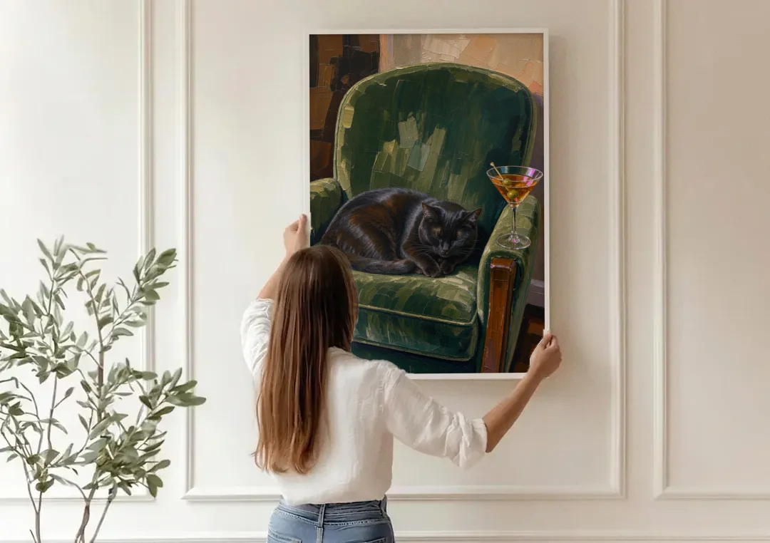Lounge Wall Art with a Black Cat and Martini canvas wall art being hung on a paneled wall